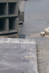 Obraz premium High angle view of an urban construction site. Abstract background with concrete structures, broken pavement, and industrial debris.