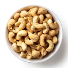 Fototapeta premium Cashews in white bowl, top view