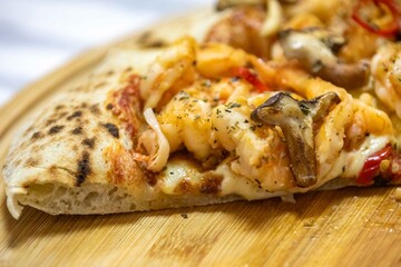 The best pizza in the world, Brazilian shrimp pizza with shiitake mushrooms and red pepper.