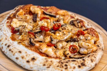 The best pizza in the world, Brazilian shrimp pizza with shiitake mushrooms and red pepper.