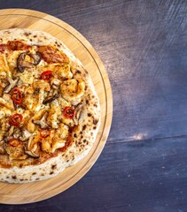 The best pizza in the world, Brazilian shrimp pizza with shiitake mushrooms and red pepper.