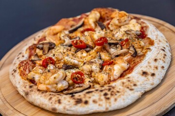 The best pizza in the world, Brazilian shrimp pizza with shiitake mushrooms and red pepper.
