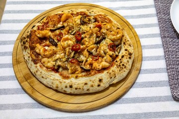 The best pizza in the world, Brazilian shrimp pizza with shiitake mushrooms and red pepper.