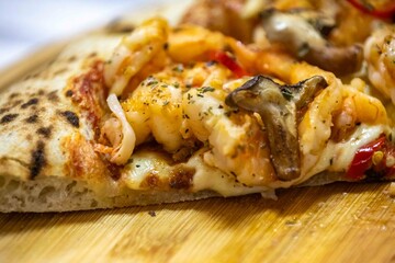 The best pizza in the world, Brazilian shrimp pizza with shiitake mushrooms and red pepper.