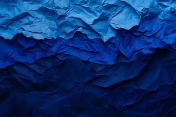 Obraz premium Textured blue crumpled paper layers creating depth and shadow gradient background effect art