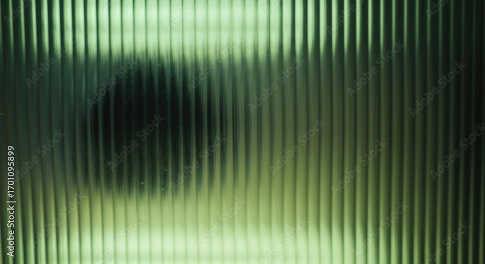 Poster abstract background of a mysterious dark silhouette seen through a green fluted or ribbed glass pane
