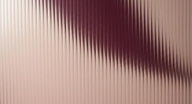 Abstract background with a ribbed texture and a color gradient from beige to deep maroon. Fluted surface with vertical lines and shadows.