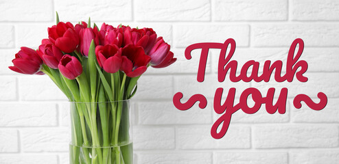 Thank You card design with bright tulips in vase against white brick wall
