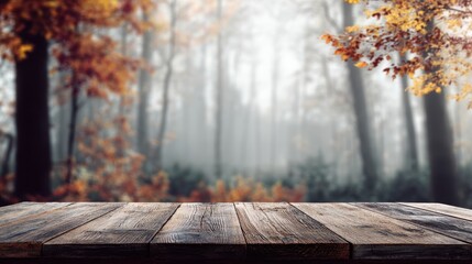 Wooden tabletop enhances autumn forest atmosphere with misty background and vibrant foliage