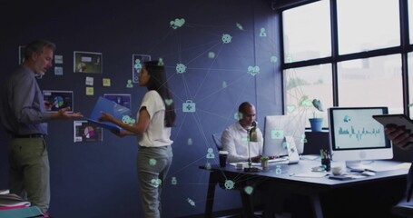 Gesturing team exchanging data at office meeting, with blue folder, charts, devices, network icons