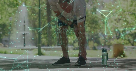 Catching breath senior man in sportswear leaning on park walkway, with bottle and data overlay