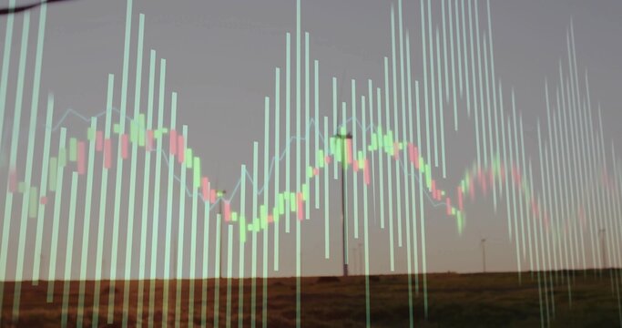 Overlaying translucent financial candlestick chart on rural wind farm field at dusk, with turbines