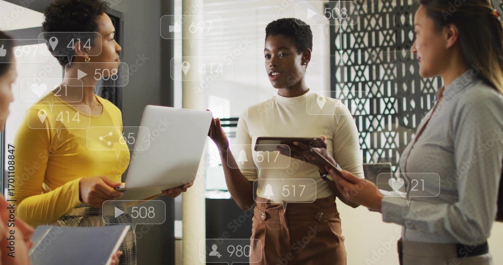 Poster collaborating four women discussing data in office holding laptops with floating metrics overlays