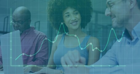 Collaborating team reviewing data in office meeting room with laptops and chart overlay