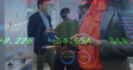 Using tablet and stylus woman in grey blazer interacting with stock overlays in office, copy space