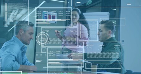 Analyzing coworkers studying holographic overlays in corporate meeting room, with printed documents