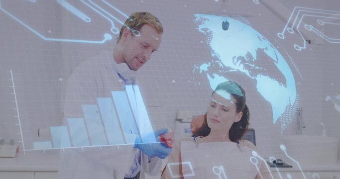 Pointing male doctor explaining heart to female patient in clinic, with red model, digital overlay