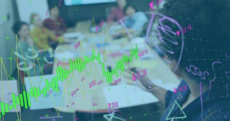 Financial analysts analyzing stock trends on laptops in conference room, with candlestick overlay