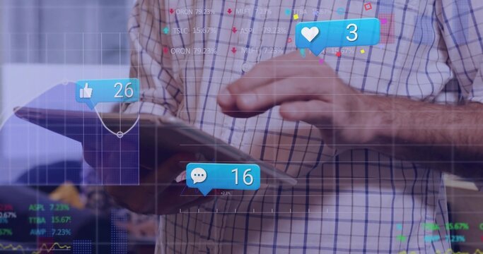 Holding tablet man wearing plaid shirt tracking floating social metrics and line graphs in office