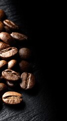 Close-up of coffee beans on dark stone