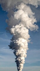 White Plume of Steam Rising Against Bright Blue Sky Environmental Concern