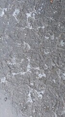 Obraz premium Wet Asphalt Abstract Background with Water Puddles and Reflections Pattern Texture