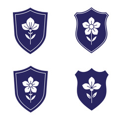 Fototapeta premium Elegant floral emblem designs in dark blue shields with white flower silhouettes