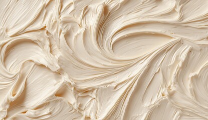 Creamy, light beige-colored frosting swirled into intricate patterns