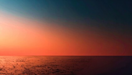 Obraz premium Orange and Blue Sunset Over Calm Ocean Water