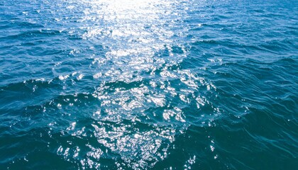 Fototapeta premium Blue Ocean Water Surface Shimmering with Sunlight Reflections on a Bright Day
