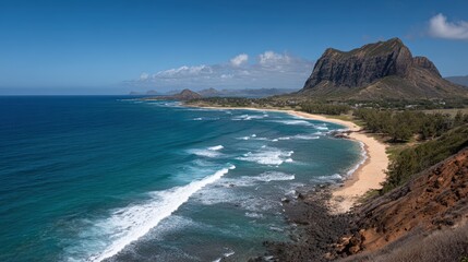 Obraz premium Breathtaking aerial view of turquoise ocean waves washing onto a sandy beach under a clear blue sky with mountains in the distance.