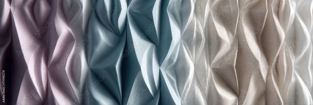 Poster textured fabric display showcasing various pastel colors and intricate folds in a light setting