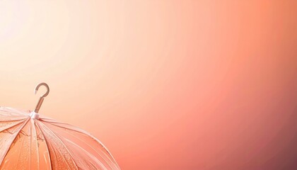 Transparent Umbrella with Water Droplets Against Warm Sunset