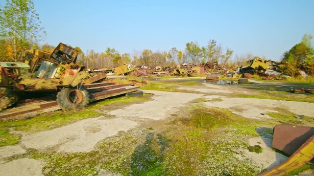Aerial view of the Rassokha Rozsokha Vehicle Graveyard, a vast junkyard within the Chernobyl Exclusion Zone, featuring abandoned and highly radioactive vehicles and machinery used during the 1986 disa