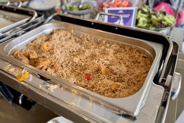 A delicious dish of rice and chicken served on a table