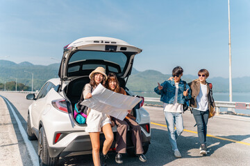 Happy Young Asian man and woman friends road trip travel countryside on summer holiday vacation....