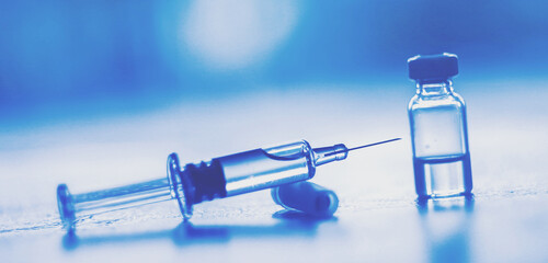 Vaccine needle​ syringe​ hypodermic​ injection single dose for prevention​ immune treatment​ illness​ virus​ covid 19 ​ child​ and adult.concept antibiotic​ drug insullin.selective focus