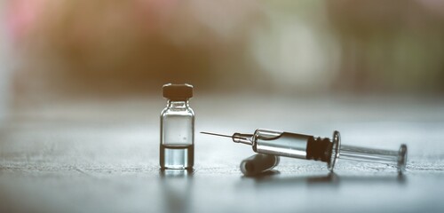 Vaccine needle​ syringe​ hypodermic​ injection single dose for prevention​ immune treatment​ illness​ virus​ covid 19 ​ child​ and adult.concept antibiotic​ drug insullin.selective focus