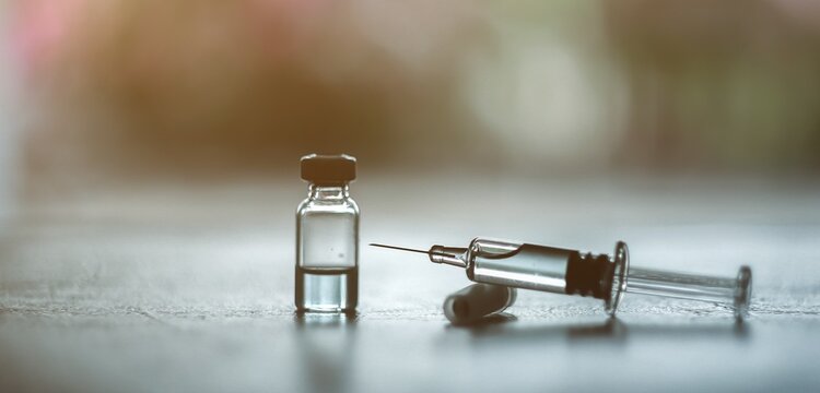 Vaccine needle​ syringe​ hypodermic​ injection single dose for prevention​ immune treatment​ illness​ virus​ covid 19 ​ child​ and adult.concept antibiotic​ drug insullin.selective focus
