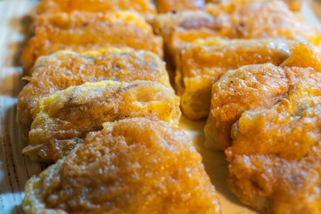 slices of the fried fermented skate on the dish