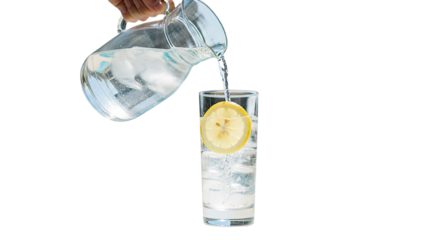 Clear cold water pouring from a bottle into a transparent glass