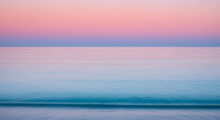 Soft pastel sunset sky over ocean horizon serene seascape background