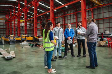 Obraz premium Team engineers and foreman gather for a meeting at the factory machines. Industry workers join together for collaboration and success.