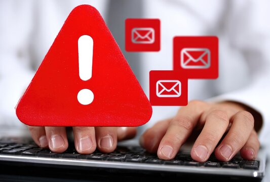 Error alert, email messages, hands on keyboard