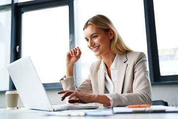 Woman working on laptop in office business