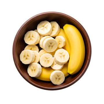 Overhead view of sliced and whole bananas in a wooden bowl.