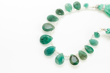 Emerald Briolette Gemstone Beads Strand with Tassels on White Background