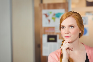 Thoughtful woman in office with hand on chin, planning creative ideas, copy space