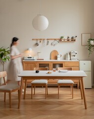 Woman in a white dress preparing tea in a cozy kitchen setting.