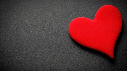 Fototapeta premium affection. A glowing red heart shape floats against a dark textured background with warm edges and soft lighting. wellbeing guides.